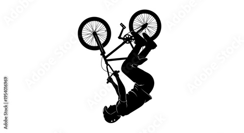Silhouette of a BMX Rider Performing a Backflip Stunt