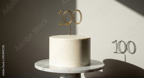 White Cake Topped with a Golden 100 Candle, Casting a Soft Shadow on a Light Wall Perfect for a Healthy Eating and Culinary Concept