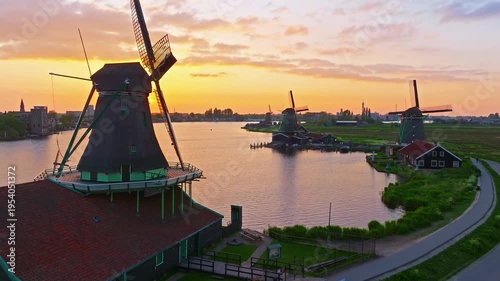 Aerial view of windmills at famous tourist site Zaanse Schans in Holland on sunset. Zaandam, Netherlands