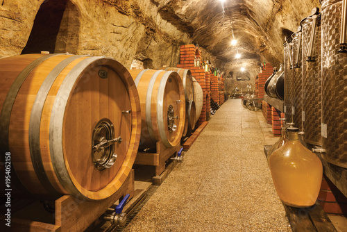 Принти на полотні Wine cellar with aging barrels and stainless steel tanks
