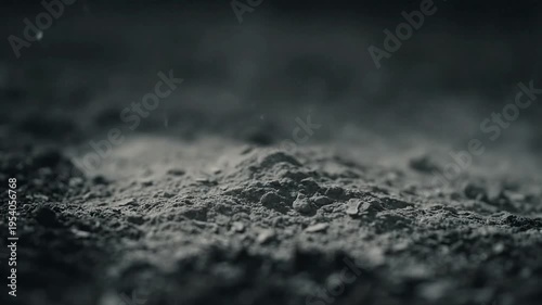 Rain Falling on Dark Ground Surface.