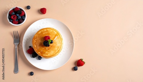 Delicious Pancakes with Fresh Berries and Syrup.