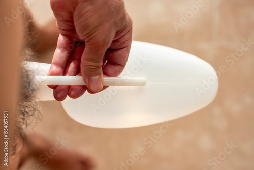 Man Holding Urinal Container – Hygiene and Healthcare Concept