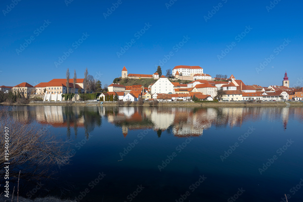 Obraz premium Ptuj cityscape reflecting in the Drava River, Slovenia