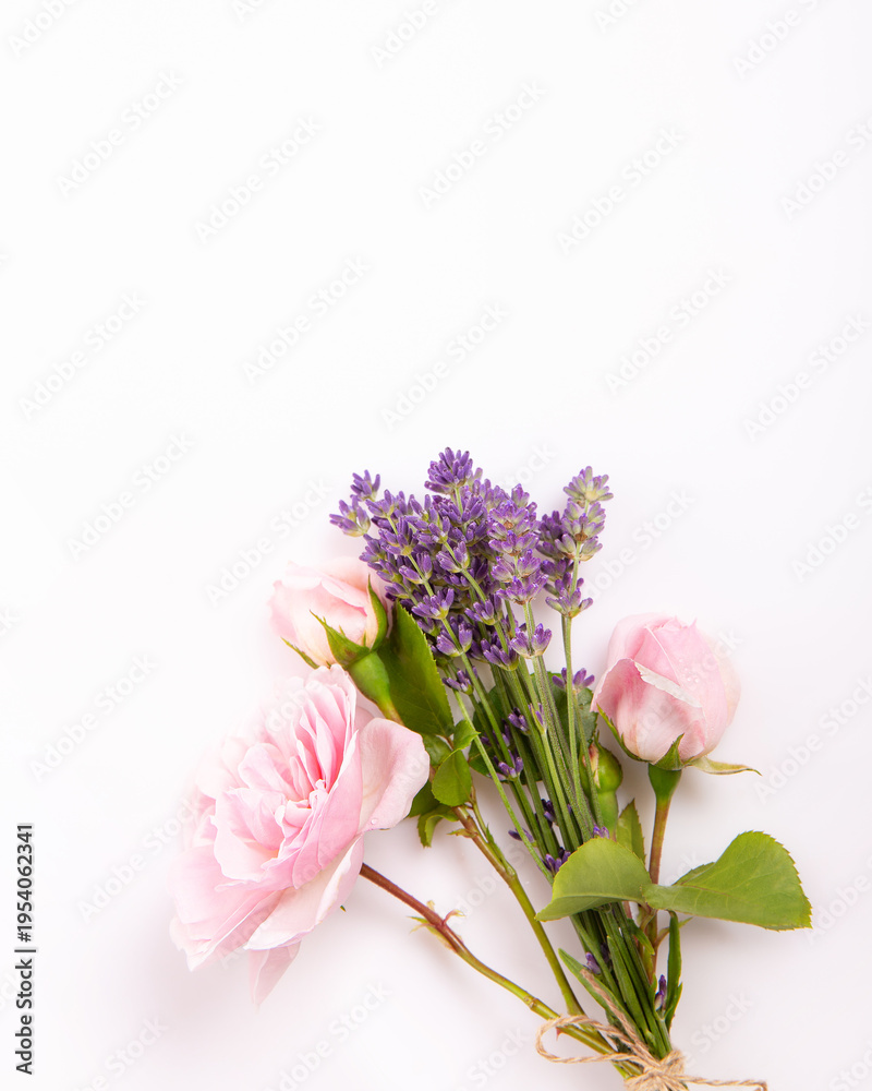 Obraz premium Pink rose and lavender bouquet on soft light background, delicate vertical floral composition with copy space. Romantic wedding, feminine greeting card, beauty, wellness, spring design