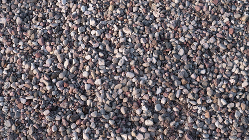 Construction Gravel Close Up Rough Aggregate Texture, Small Crushed Stones Forming Dense Industrial Surface, Neutral Gray And Brown Tones, Coarse Tactile Detail Suitable For Concrete Mix,