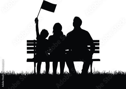 Silhouette of family sitting on bench with child waving flag
