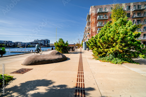 Copenhagen promenade with people walking and cyclists, Østerbro district, everyday life in Denmark.