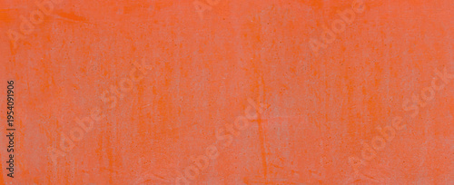 Orange surface showing weathered paint and abstract texture