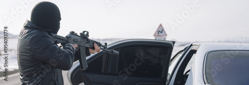 Quadro em tela Criminal Attacks Vehicle with Weapon in Hand