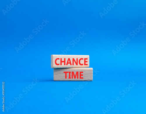 Chance Time symbol. Wooden blocks with words Chance Time. Beautiful blue background. Health and Chance Time concept. Copy space.