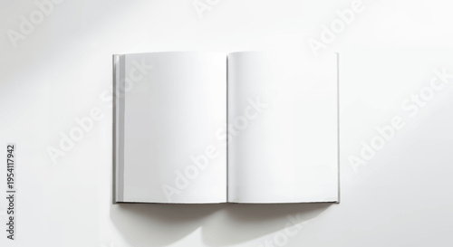 Blank open book on white background with soft shadows