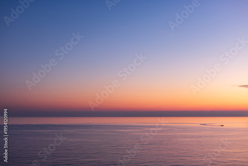 Beautiful seascape of the Amalfi Coast in Italy during a colorful sunset at dusk