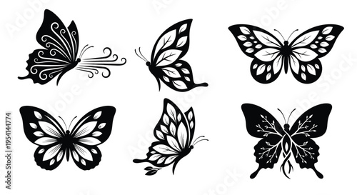 A collection of six black butterflies with unique patterns fly together outdoors.