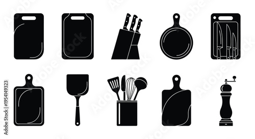 A collection of kitchen utensils and cutting boards on a white background