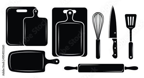 Kitchen utensils and cutting boards arranged on a clean surface