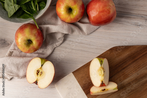 Cut apple on wooden board food preparation fresh fruit