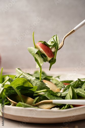 Fork lifting apple salad healthy eating fresh food