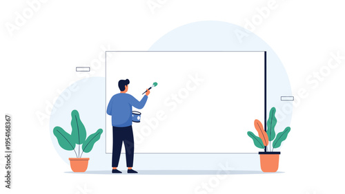 Artist painting a large blank white canvas with a brush in a minimalist studio setup with potted plants on either side.