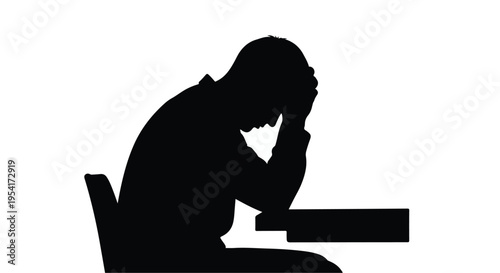 Silhouette of a Stressed Person Sitting at Desk - Burnout and Mental Health Concept