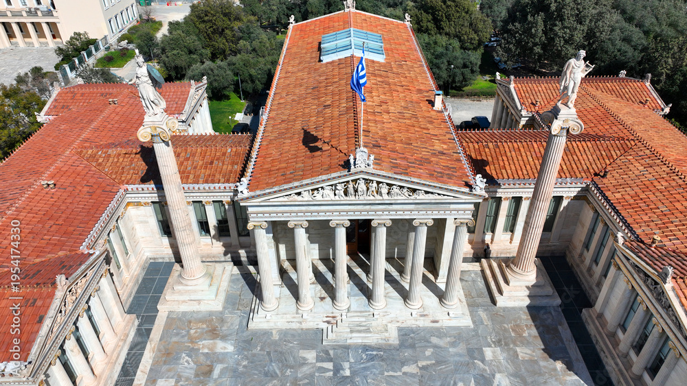 Fototapeta premium Aerial drone photo of historic Neoclassic building of Academy of Athens featuring statue of goddess Athena in Acadimias street, Attica, Greece