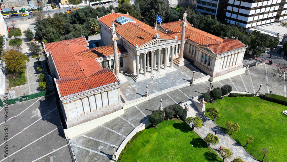 Fototapeta premium Aerial drone photo of historic Neoclassic building of Academy of Athens featuring statue of goddess Athena in Acadimias street, Attica, Greece