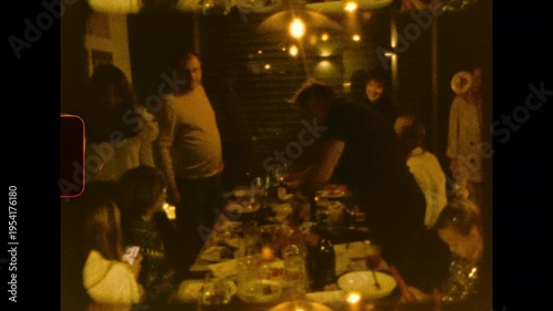 Detailed view of roast meat being carved with a large knife on analog super 8mm film