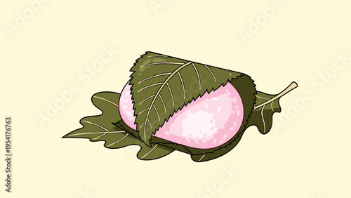 Traditional Japanese pink mochi dessert wrapped in green leaves known as sakuramochi typically enjoyed during the spring season.