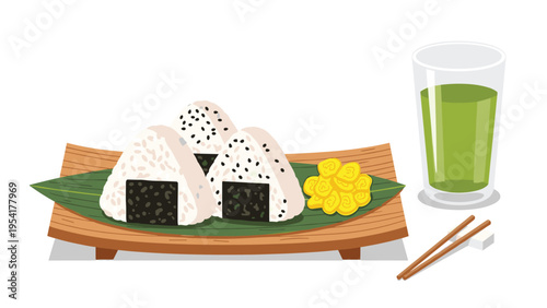 Delicious traditional Japanese snack featuring three rice balls or onigiri served on a bamboo leaf with green tea and yellow pickled radish.