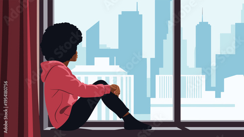 Young woman with curly hair looks out of an apartment window at the urban city skyscrapers during a moment of reflection.