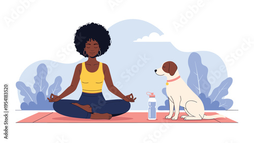 Fit young woman practicing yoga in a lotus pose on a mat in a park with her dog sitting calmly beside her in the grass.