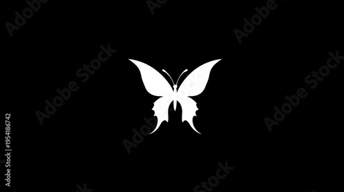 A white silhouette of a butterfly against a black background. Focused in the middle