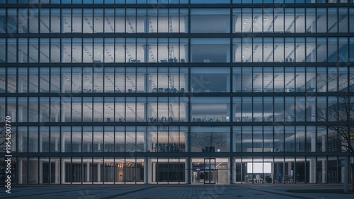 A large modern office building with many windows and a glass facade