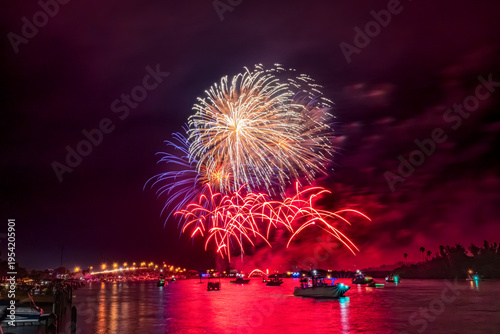 Spectacular Fireworks Display Over a Vibrant Night Sky in Florida, Indian River Lagoon, New Smyrna Beach, USA