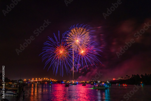 Spectacular Fireworks Display Over a Vibrant Night Sky in Florida, Indian River Lagoon, New Smyrna Beach, USA