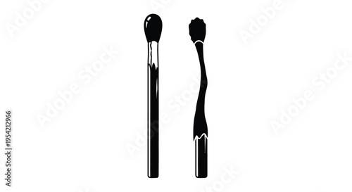 Two black matches displayed vertically a striking visual silhouette