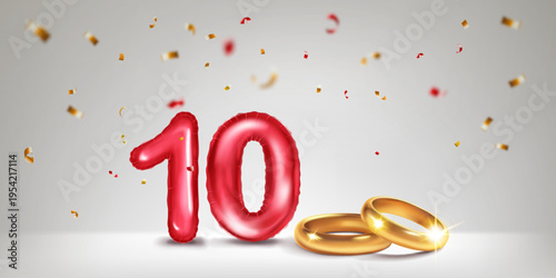 A red number 10 in the form of an inflatable balloons with two gold wedding rings, symbolizing the celebration of the tenth wedding anniversary, surrounded by colorful confetti, on light background.