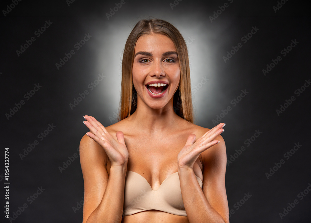 Fototapeta premium Excited Young Woman Expressing Surprise With Open Hands Gesture.