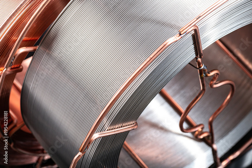 Obraz na plátně Close up detail of steel welding wire on spool