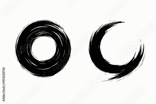 Two black brush stroke circles, one complete and one crescent, on a white background