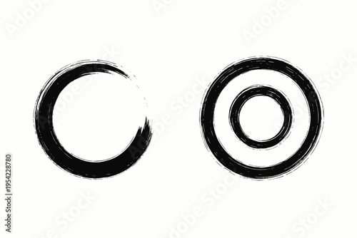 Two black ink brush stroke circles, one incomplete, on a white textured background