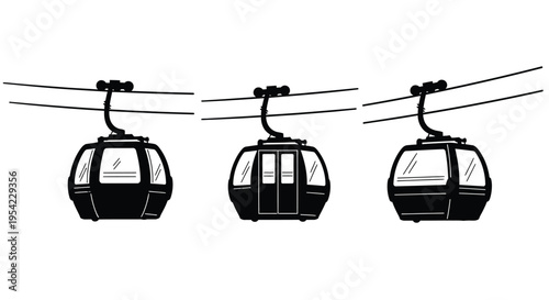 Three cable cars suspended on cables a striking black silhouette