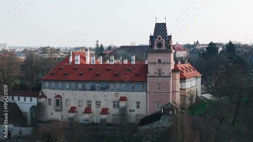 Aerial drone view of Brandýs nad Labem castle with baroque tower and historic town, Czech Republic