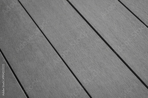 Billede på lærred Grey composite wood decking planks in diagonal perspective view.