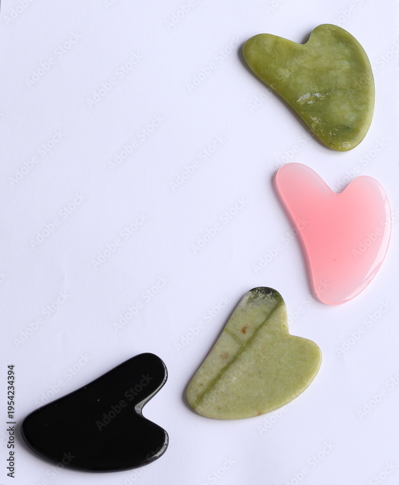 Obraz premium four multi-colored gua sha made of natural stone