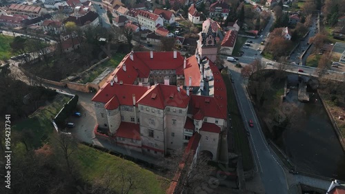 Aerial drone tilt down view of Brandýs nad Labem castle complex with town, Czech Republic