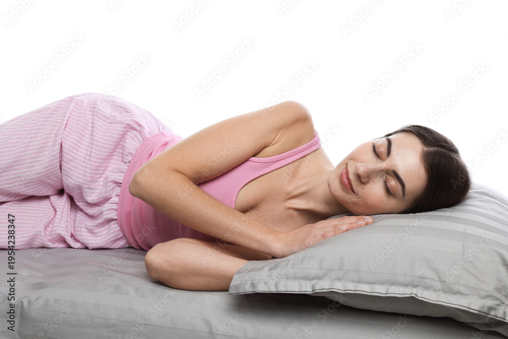 Fototapeta premium Woman in pajamas sleeping on bed against white background