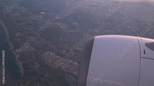 aerial shot from a passenger plane captures the Mediterranean coastline concept of international air travel and geographic exploration.