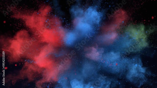 Colorful powder explosion in mid-air, creating vibrant red, blue, and green clouds against a dark background, often used for celebrations