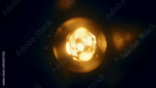 A bright sun shines in a starry night sky with many glowing particles
